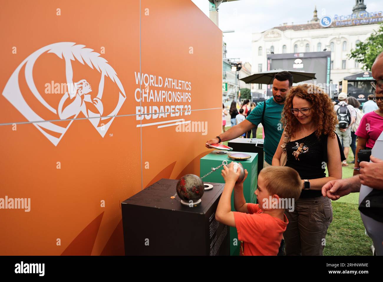 Budapest. 17th Aug, 2023. A child tries a shotput ball at a fan zone of