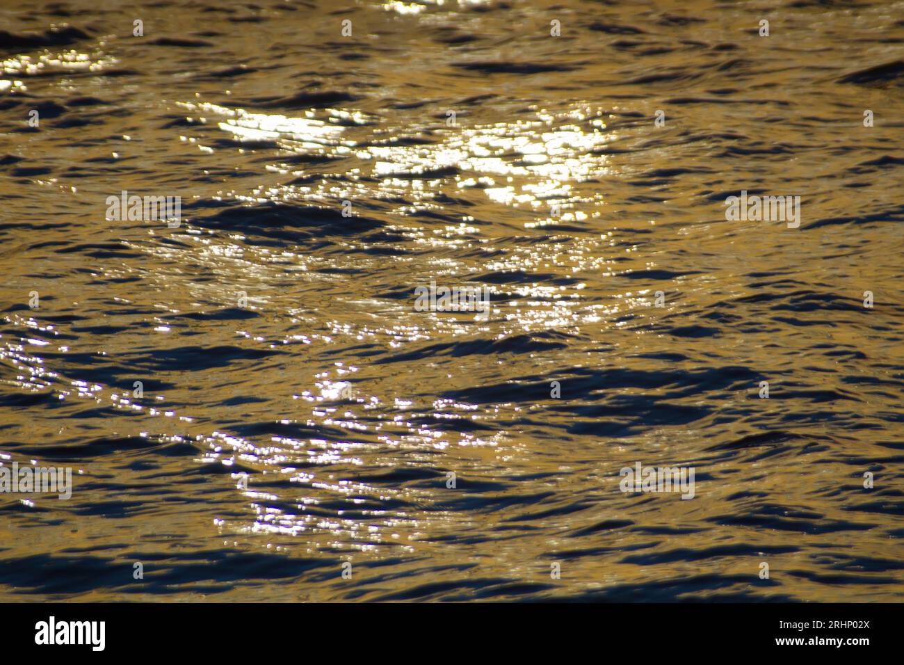 Sun glare on the water on a hot summer day. Photography in backlight Stock Photo