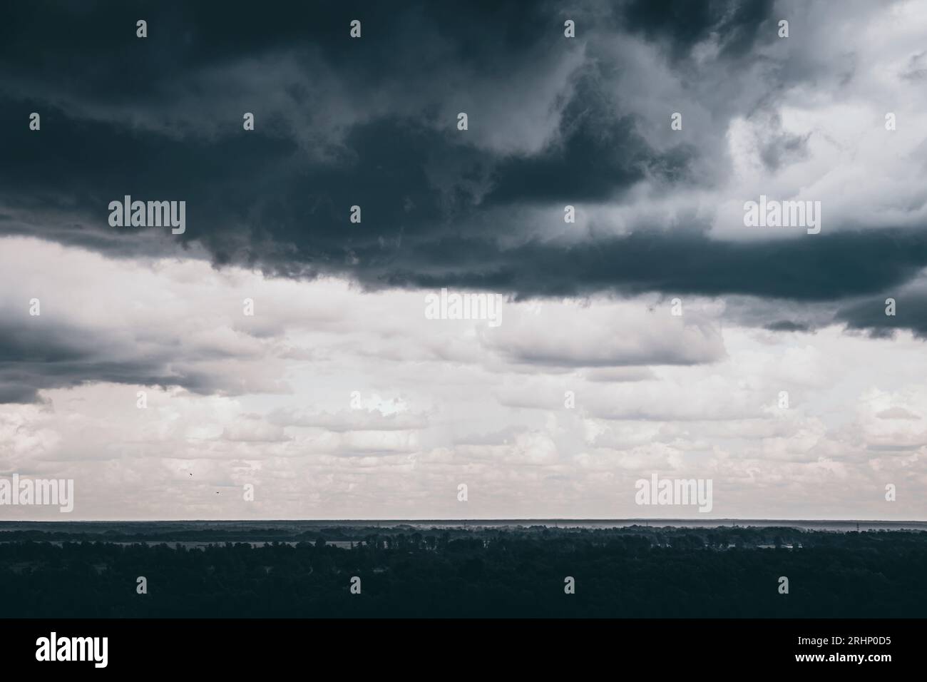 Dark sky and black clouds before rainy, Dramatic black cloud and thunderstorm Stock Photo