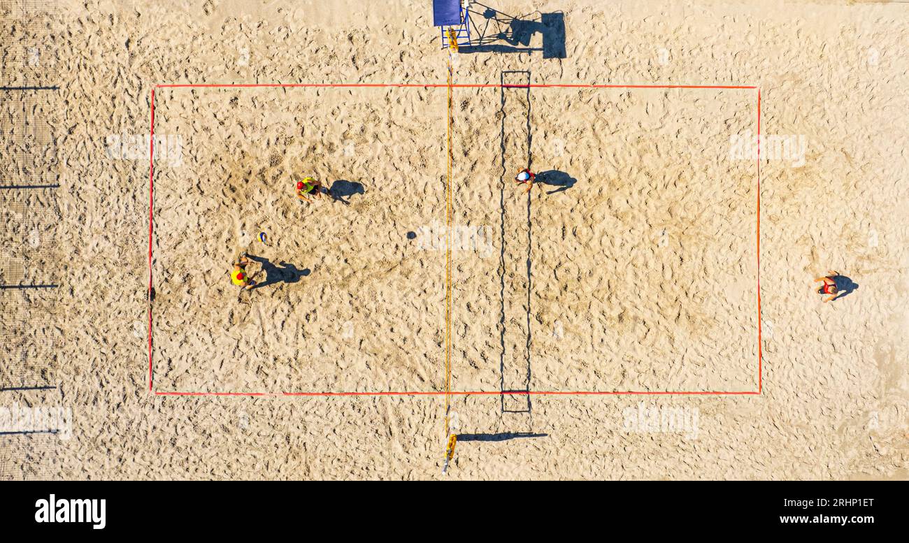 Aerial view of playing volleyball. Top view of the volley ball court during game. Stock Photo