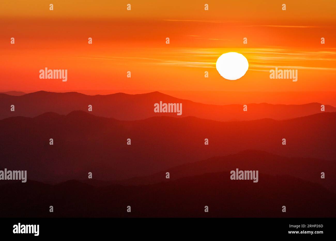 Sunset, Great Smoky Mountains National Park - Swain County, North Carolina. The sun sets behind the layers of mountain ridges visible from Clingmans D Stock Photo