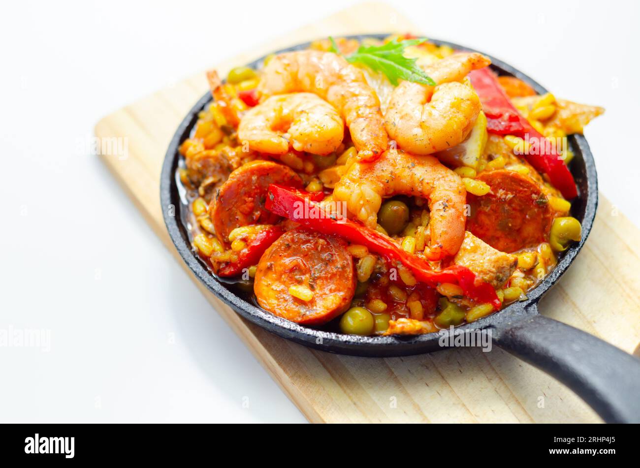 Delicious paella, cooked risotto rice with chicken thigh, king prawns