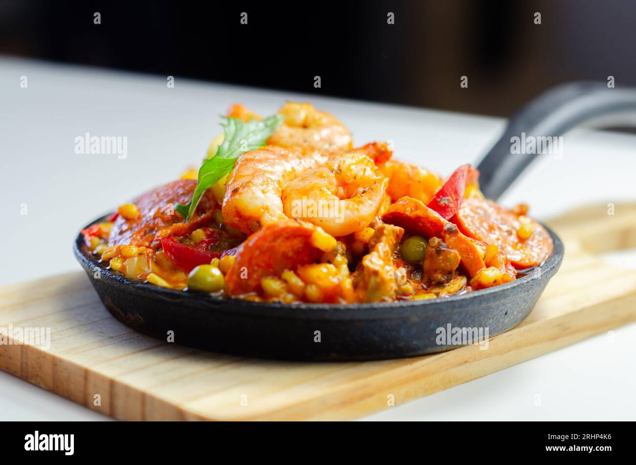Delicious paella, cooked risotto rice with chicken thigh, king prawns