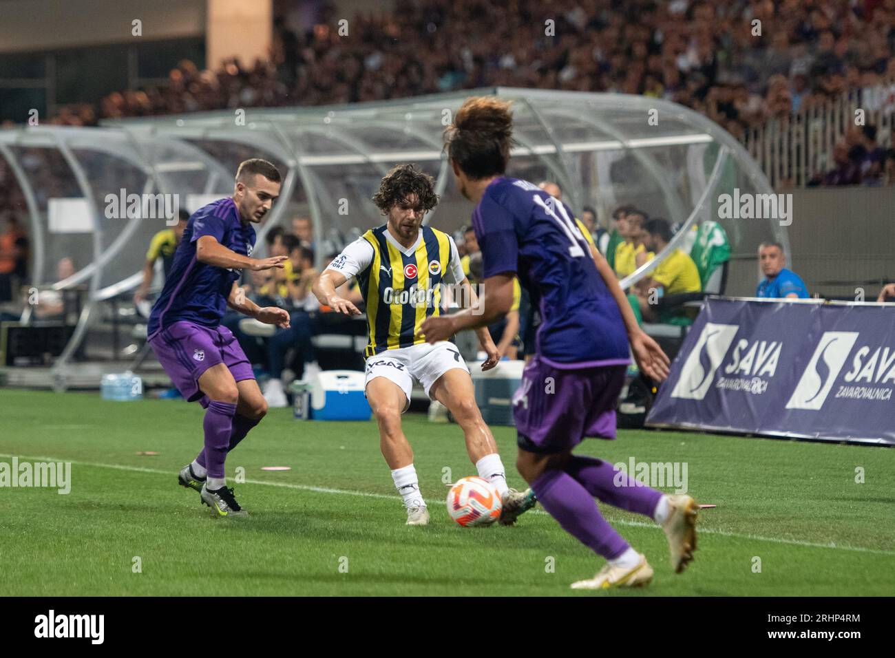 Ivan Brnic (L) of Maribor and Ferdi Kadioglu (C) of Fenerbahce seen in action during the UEFA Europa Conference League 3rd qualifying round second leg match between Maribor and Fenerbahce at Ljudski Vrt Stadium. Final score; Maribor 0:3 Fenerbahce. Stock Photo