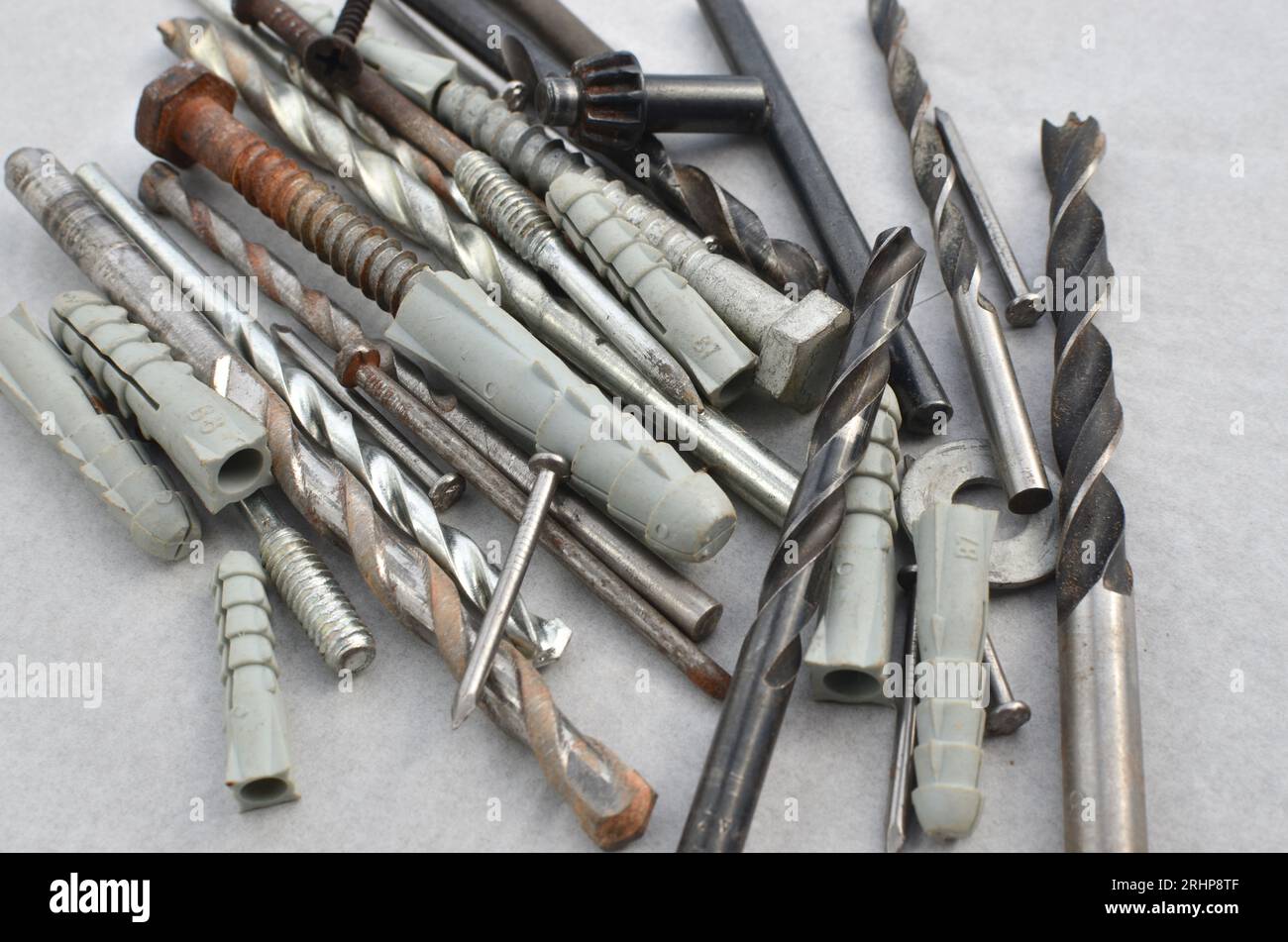 Closeup of drill bits with screws ready for work, representing