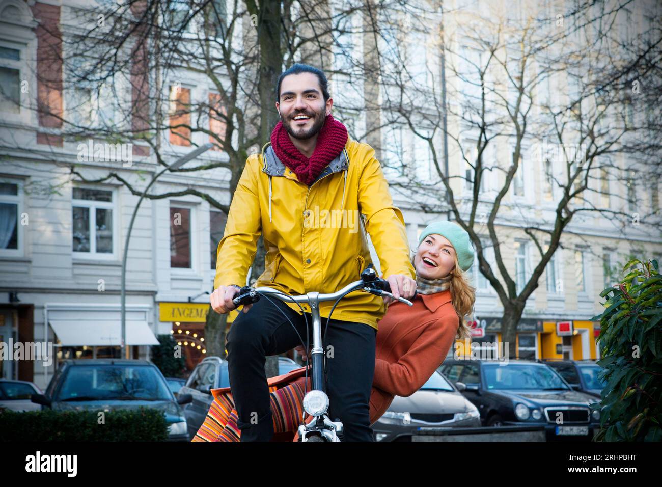 Man with woman on bicycle Stock Photo