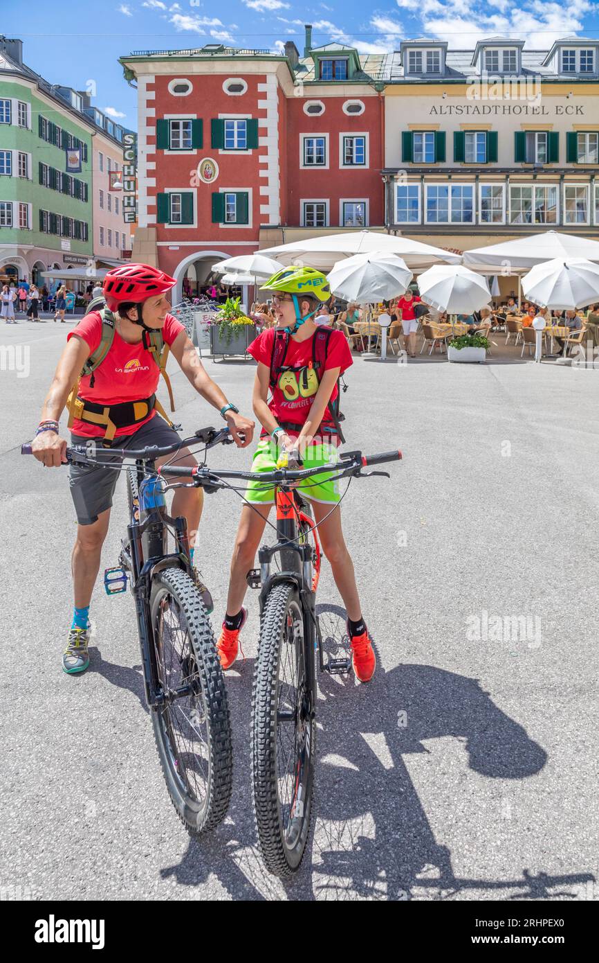 Austria, East Tyrol, Drava cycle path, two people, mother and daughter with bicyles in the center of Lienz Stock Photo