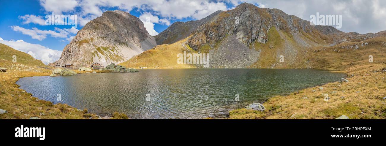 Austria, East Tyrol, district of Lienz, Kartitsch. The alpine hut Obstansersee Hütte and the little alpine lake in the Carnic Alps Stock Photo