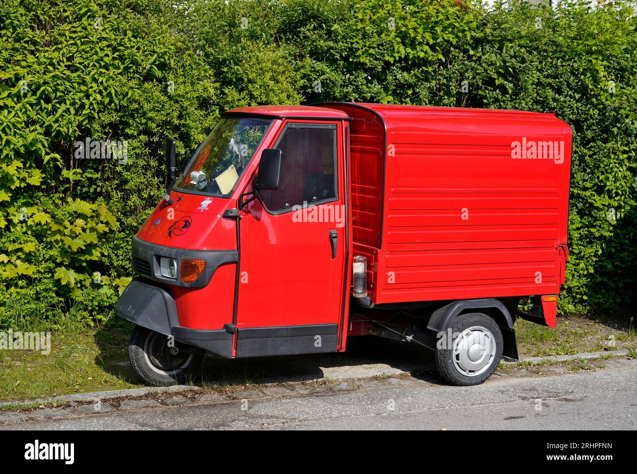 Germany, Bavaria, Upper Bavaria, Altötting, three-wheeled van, red, Piaggio Ape 50 box Stock Photo