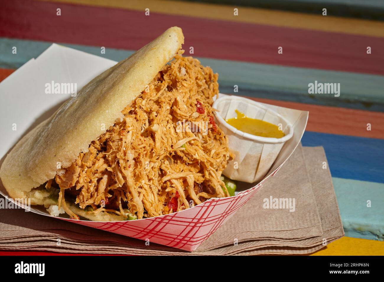 Venezuelan arepa stuffed with chicken as served in Queens, NY, USA