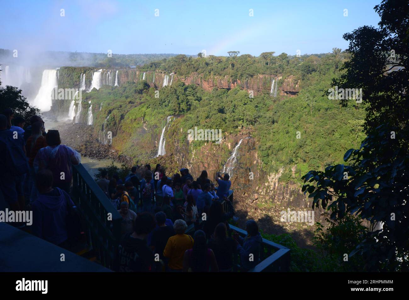 Tourists at Iguazu Falls, one of the great natural wonders of the world, on the border of Brazil and Argentina. Stock Photo