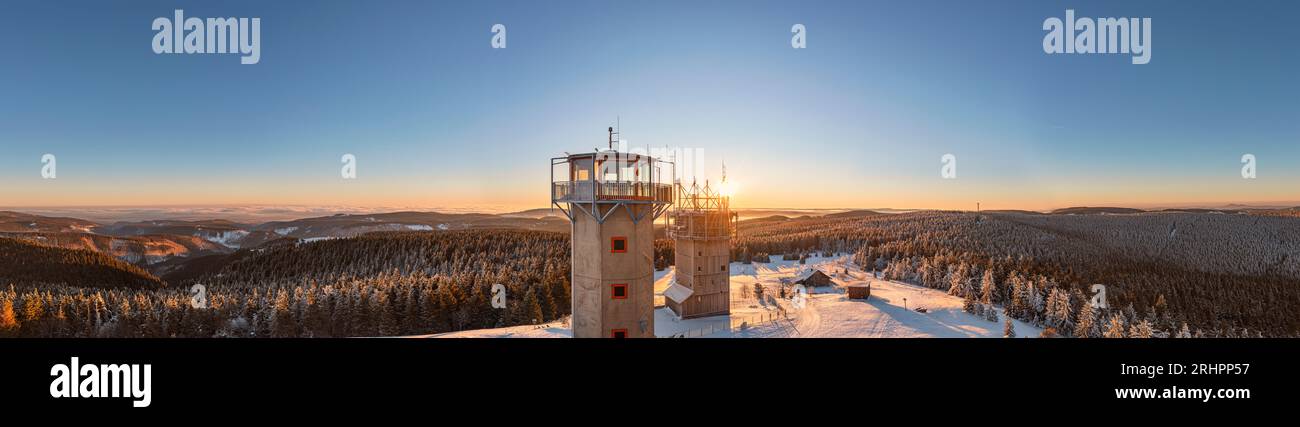 Germany, Thuringia, Suhl, Gehlberg, Schneekopf (second highest mountain of Thuringian Forest), lookout and climbing tower, telecommunication tower, New Gehlberg Hut, forest, mountains, snow, sunrise, backlight, overview, aerial photo, panorama photo Stock Photo