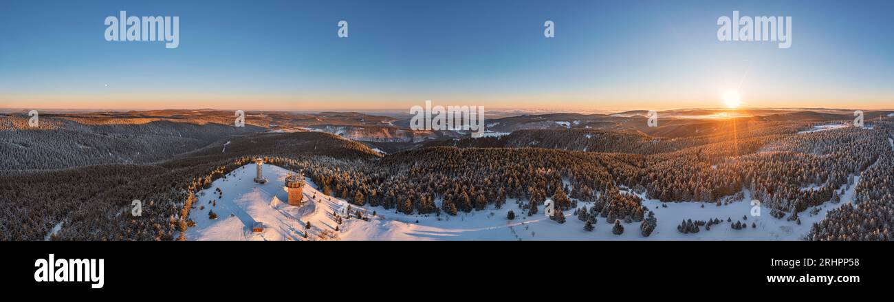 Germany, Thuringia, Suhl, Gehlberg, Schneekopf (second highest mountain of the Thuringian Forest), observation and climbing tower, telecommunications tower, restaurant, forest, mountains, snow, sunrise, partly backlight, overview, aerial view, 36ö° panorama Stock Photo