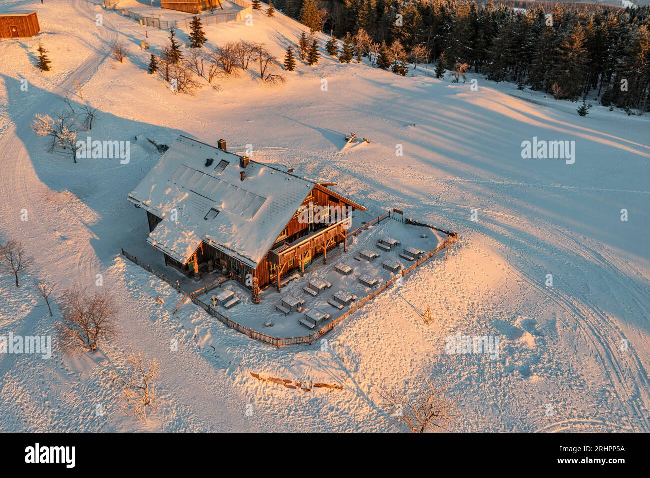 Germany, Thuringia, Suhl, Gehlberg, Schneekopf (second highest mountain of Thuringian Forest), Neue Gehlberger Hütte, snow, morning light, overview, oblique view, aerial view Stock Photo