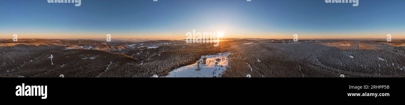 Germany, Thuringia, Suhl, Gehlberg, Schneekopf (second highest mountain of the Thuringian Forest), observation and climbing tower, telecommunication tower, New Gehlberg Hut, forest, mountains, snow, sunrise, partly backlight, overview, aerial view, 36ö° panorama Stock Photo