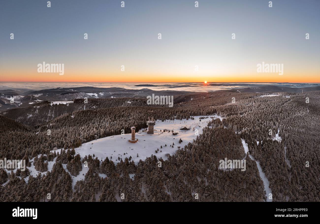 Germany, Thuringia, Suhl, Gehlberg, Schneekopf (second highest mountain of Thuringian Forest), observation and climbing tower, telecommunication tower, New Gehlberg Hut, forest, mountains, snow, sunrise, backlight, aerial photo Stock Photo