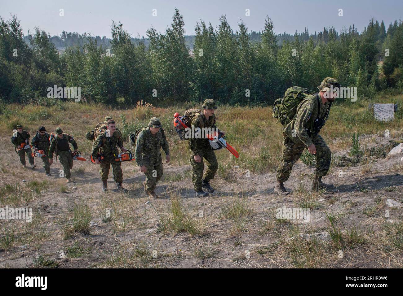 (230818) -- NORTHWEST TERRITORIES (CANADA), Aug. 18, 2023 (Xinhua) -- Photo taken on Aug. 16, 2023 shows members of the Canadian Armed Forces heading to work on a firebreak in Yellowknife, Northwest Territories, Canada. The government of Canada's Northwest Territories declared a state of emergency on Tuesday and issued the evacuation order on Wednesday in response to out-of-control wildfires. Mass evacuation of areas in the territory is ongoing, including the capital city of Yellowknife, the territory's largest community with a population of more than 20,000. Residents were ordered to leave by Stock Photo