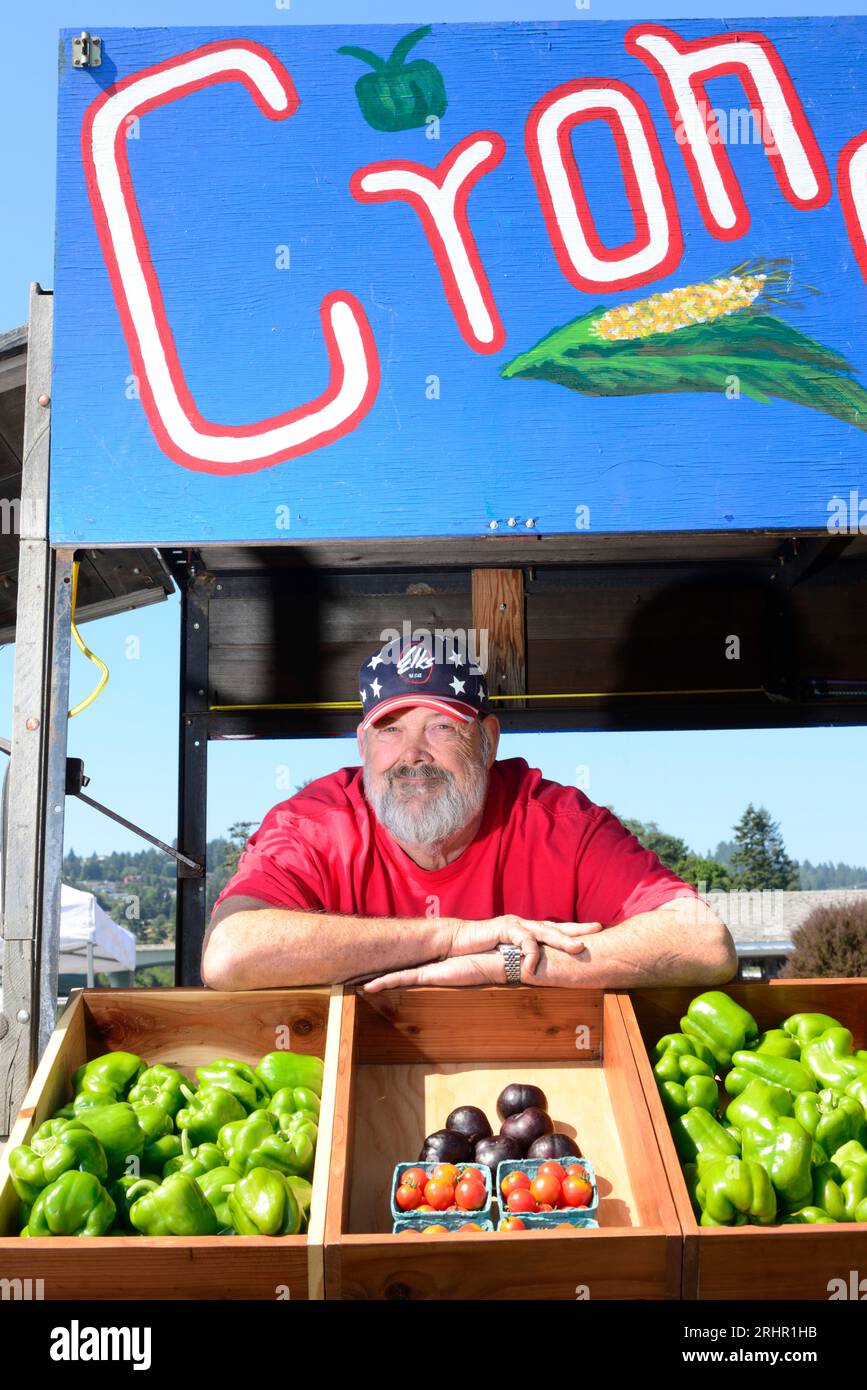 Man with vegetable stall,  Brookings Harbor, Brookings, Oregon, USA Stock Photo