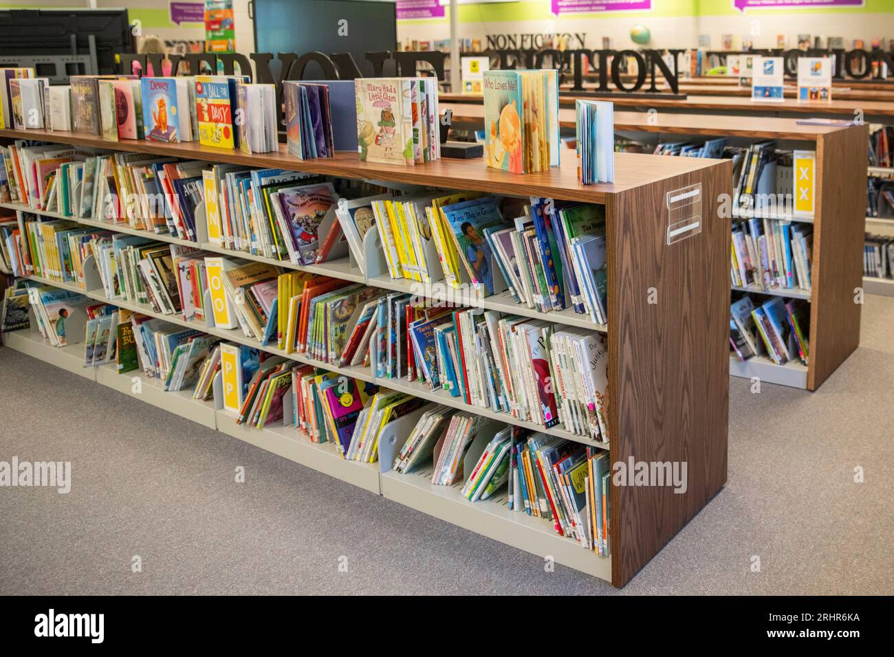 Books sit on shelves in an elementary school library in suburban ...