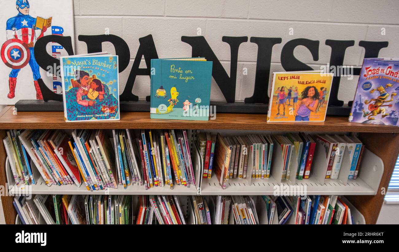 Books sit on shelves in an elementary school library in suburban ...