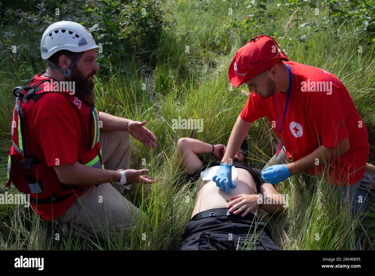 Paramedics train to provide first aid to a man allegedly injured in an ...