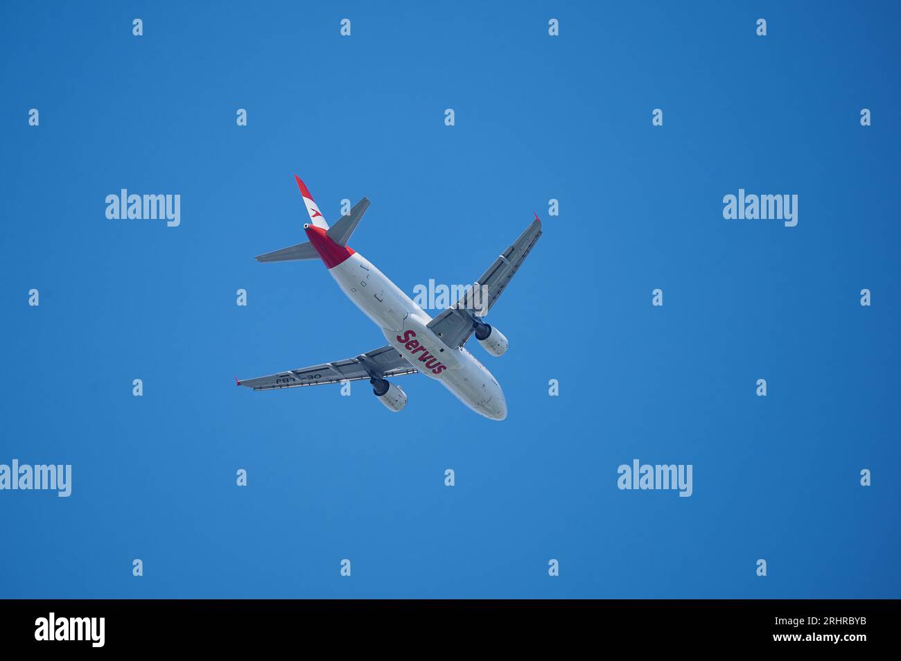 Mainz, Germany - August 18, 2023: Austrian airline plane in red and white over Mainz-Hechtsheim, shortly before landing in Frankfurt am Main Stock Photo