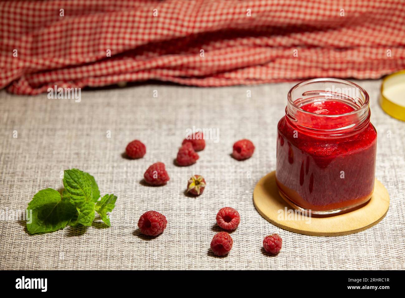 Homemade raspberry jam in a glass jar. Food preservation. Healthy ...