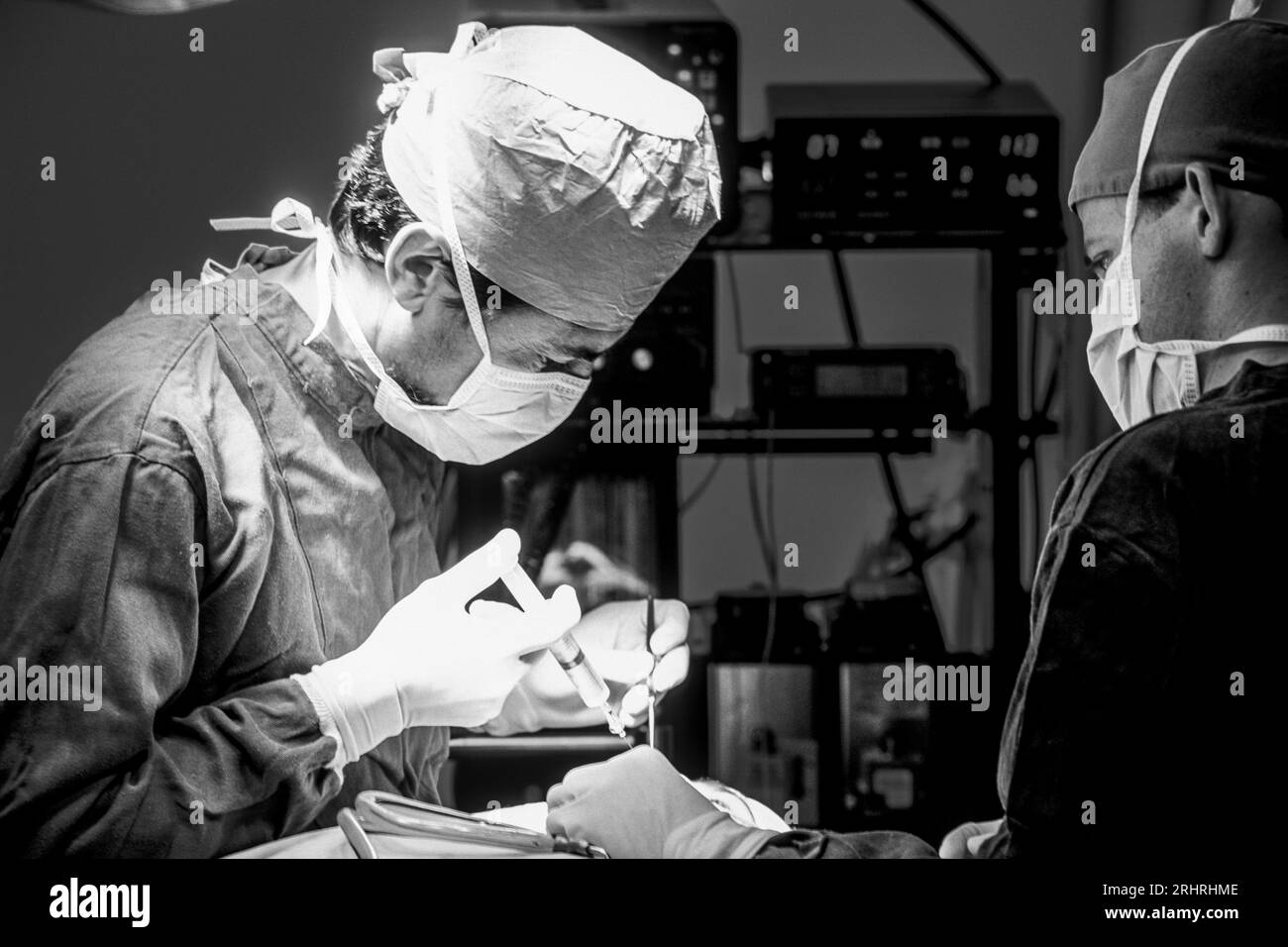 Plastic surgeons in action in the operating room Stock Photo