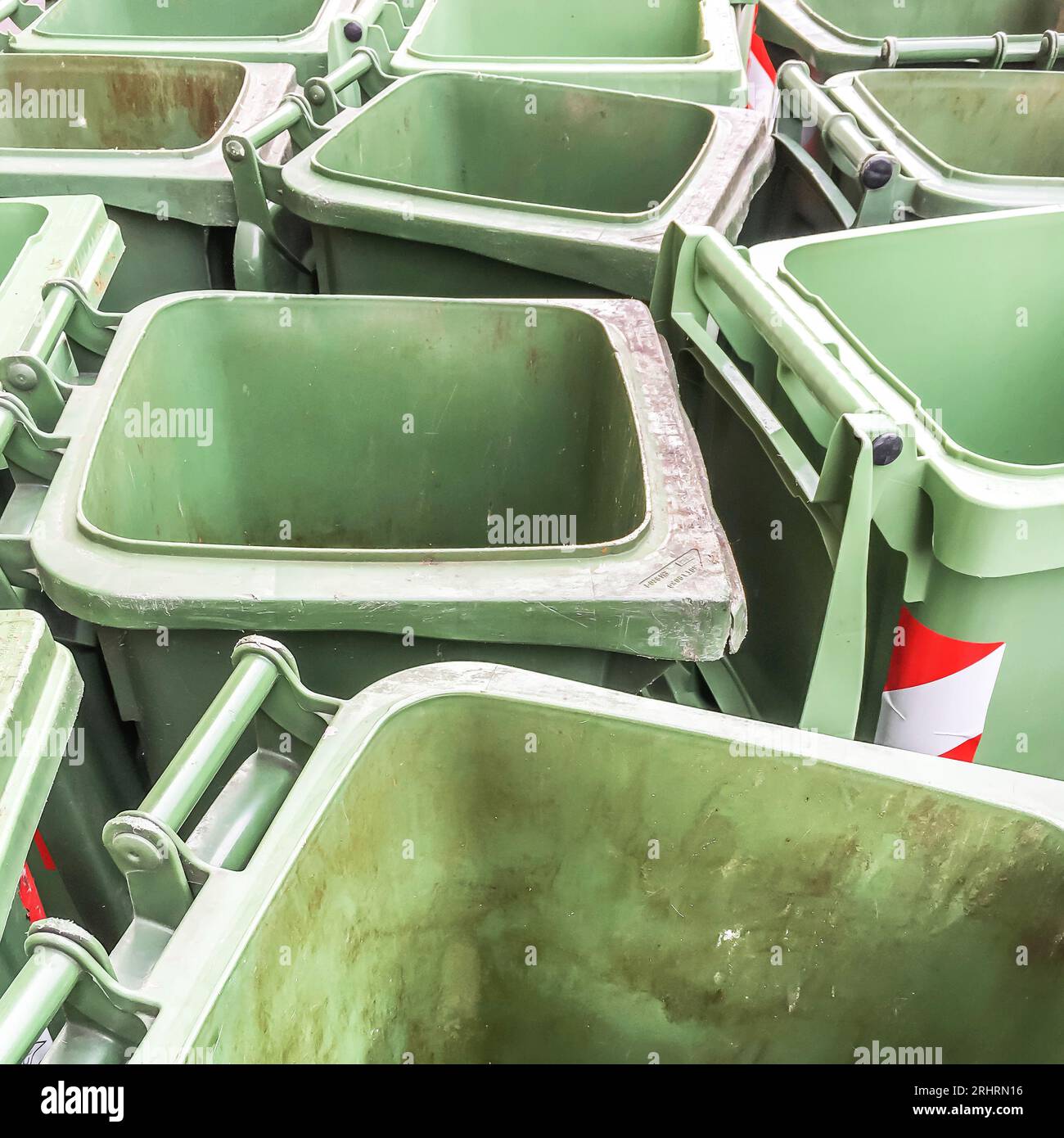 Row of empty green rubbish bins on the street Stock Photo Alamy