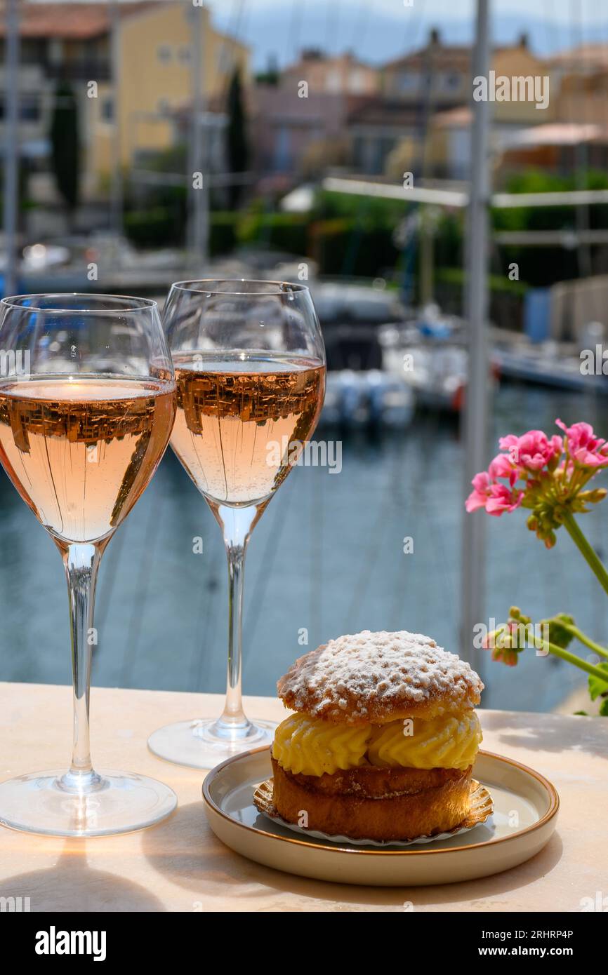 Wine and cakes of French Riviera, glasses of cold rose Cote de Provence wine  and Tarte Tropezienne cake in yacht harbour of Port Grimaud, summer vacat  Stock Photo - Alamy