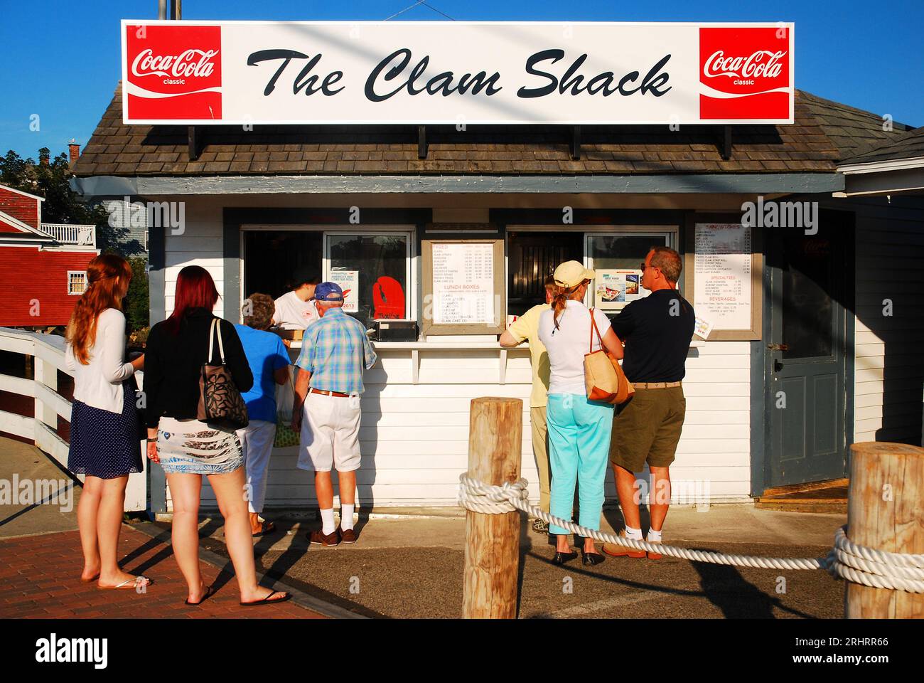 Folks line up at a clam shack in Kennebunkport, Maine for a summer meal to get clais or a lobster roll Stock Photo
