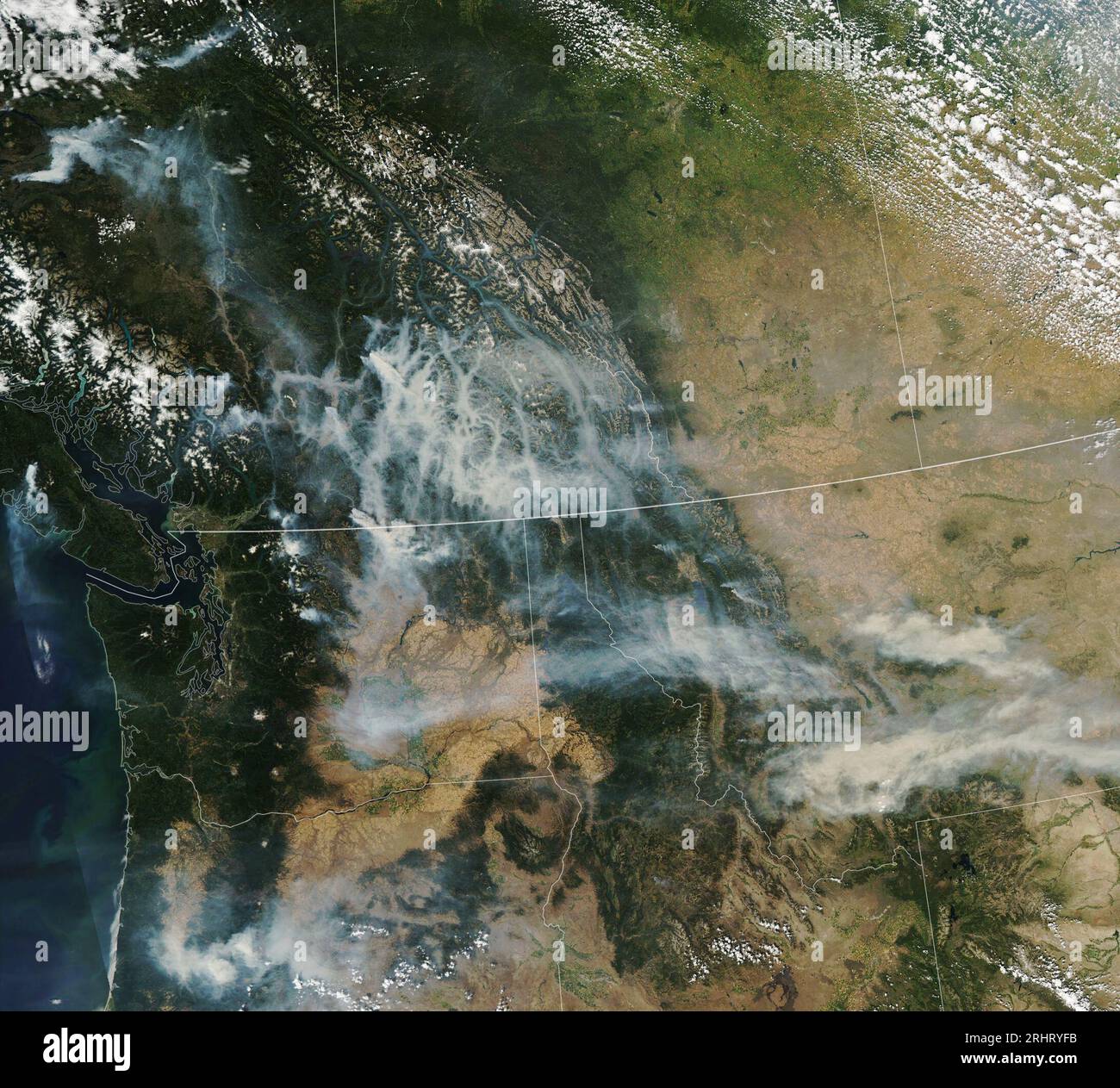 Pacific Northwest USA 16th Aug 2023 Extreme Heat Bouts Of Strong   Pacific Northwest Usa 16th Aug 2023 Extreme Heat Bouts Of Strong Winds And A Prolonged Drought Are Fueling Large Forest Fires In Western Canada And The United States The Moderate Resolution Imaging Spectroradiometer Modis On Nasas Aqua Satellite Acquired This Image Of Smoke Spreading Across Parts Of British Columbia Washington Oregon And Montana On August 16 2023 That Same Day Astronauts Aboard The International Space Station Captured The Detailed Photograph Below Which Shows Smoke In Valleys In British Columbia Near The Towns Of Golden And Revelstoke Credit Image Nasa E 2RHRYFB 