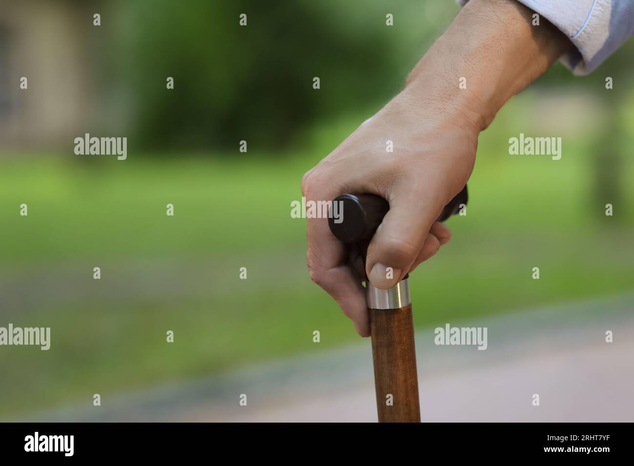Senior man with walking cane outdoors, closeup Stock Photo - Alamy