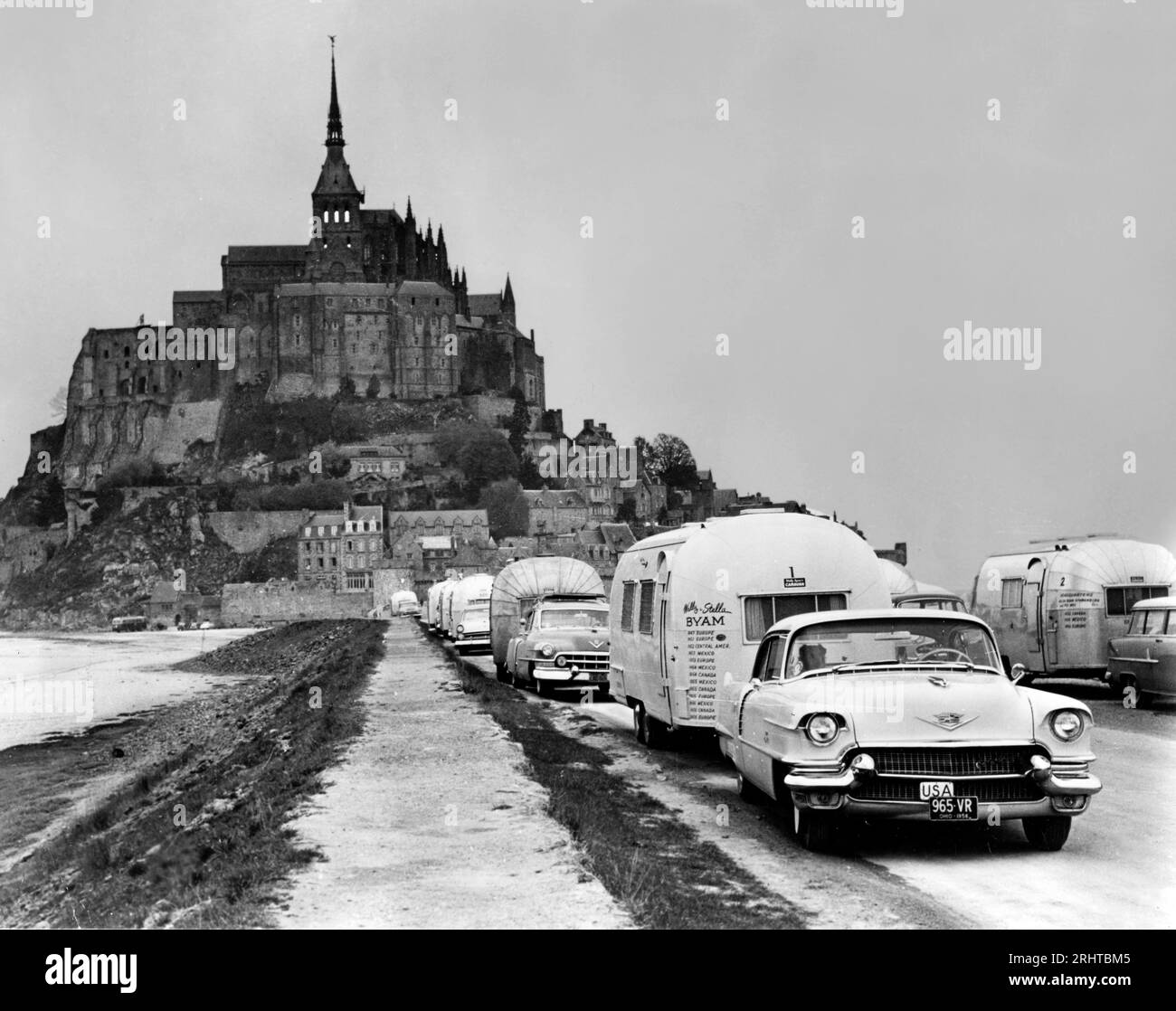 A Wally Byam led caravan of Airstream Trailers visits the Mont Saint Michel cathedral in the Normandie region of France,. Stock Photo