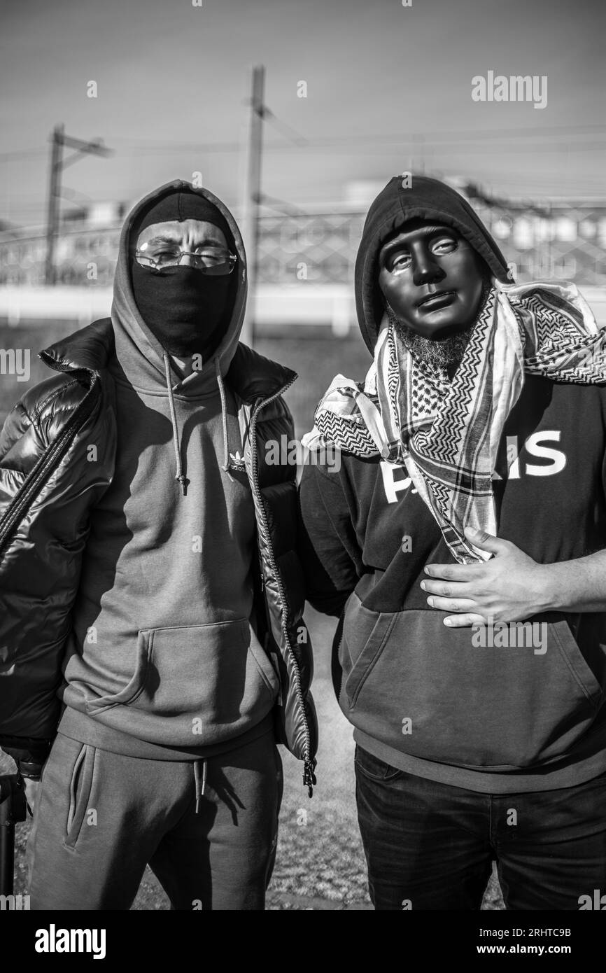Brothers With Mask Black and White Stock Photo