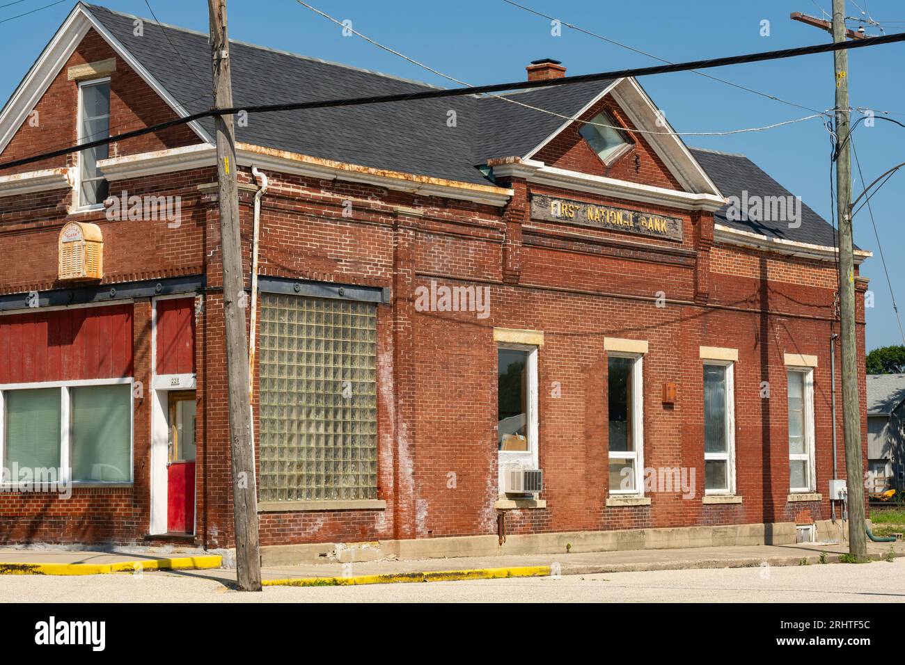Exterior of old brick bank building in downtown Malta, Illinois, USA