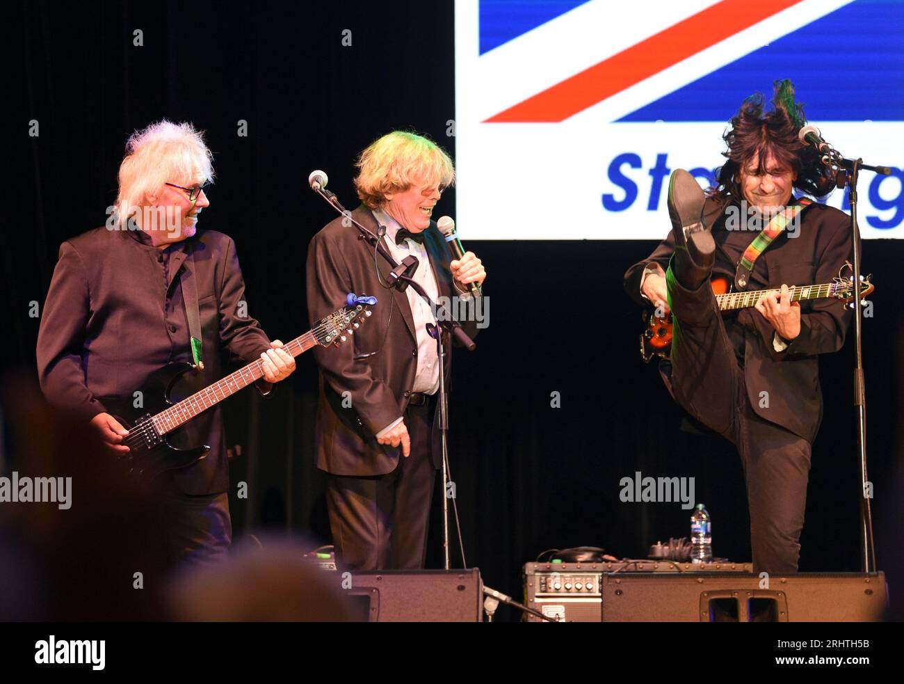 Hiawassee, GA, USA. 18th Aug, 2023. Kevin Lingard, Peter Noone, Vance Brescia on stage for Peter Noone in Concert at Georgia Mountain Fairgrounds, Anderson Music Hall, Hiawassee, GA August 18, 2023. Credit: Derek Storm/Everett Collection/Alamy Live News Stock Photo