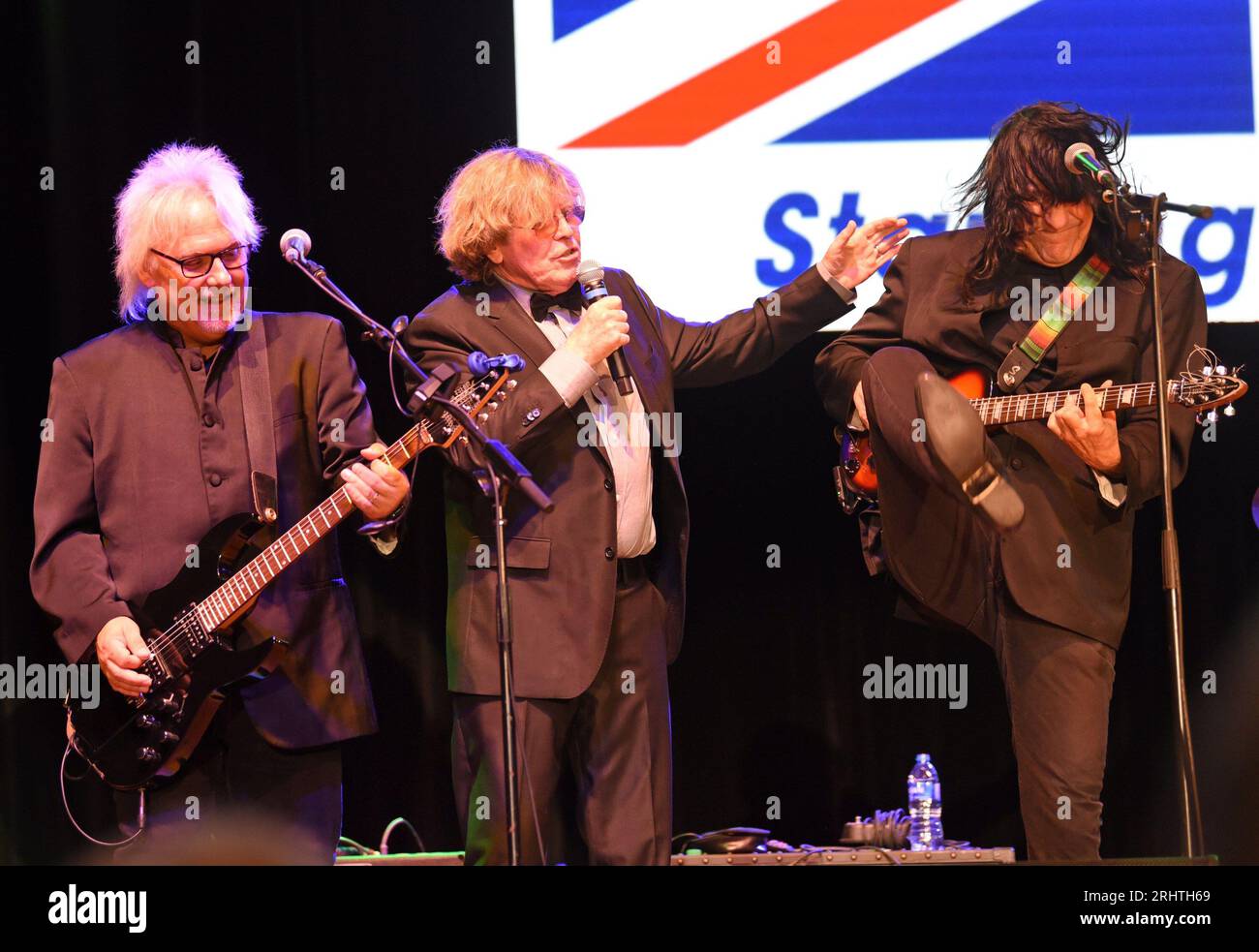 Hiawassee, GA, USA. 18th Aug, 2023. Kevin Lingard, Peter Noone, Vance Brescia on stage for Peter Noone in Concert at Georgia Mountain Fairgrounds, Anderson Music Hall, Hiawassee, GA August 18, 2023. Credit: Derek Storm/Everett Collection/Alamy Live News Stock Photo