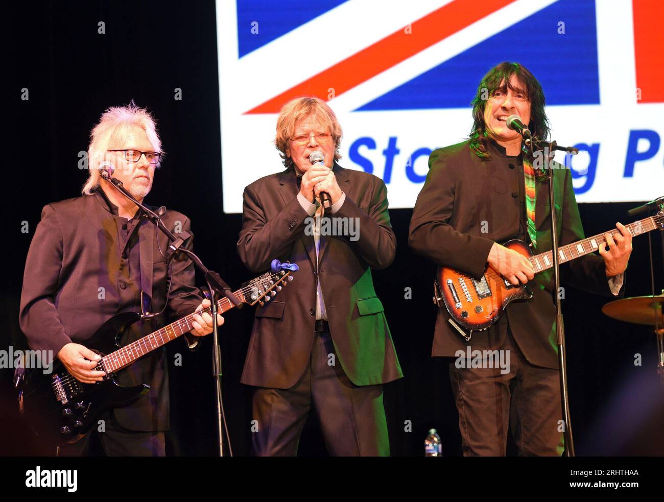Hiawassee, GA, USA. 18th Aug, 2023. Kevin Lingard, Peter Noone, Vance Brescia on stage for Peter Noone in Concert at Georgia Mountain Fairgrounds, Anderson Music Hall, Hiawassee, GA August 18, 2023. Credit: Derek Storm/Everett Collection/Alamy Live News Stock Photo