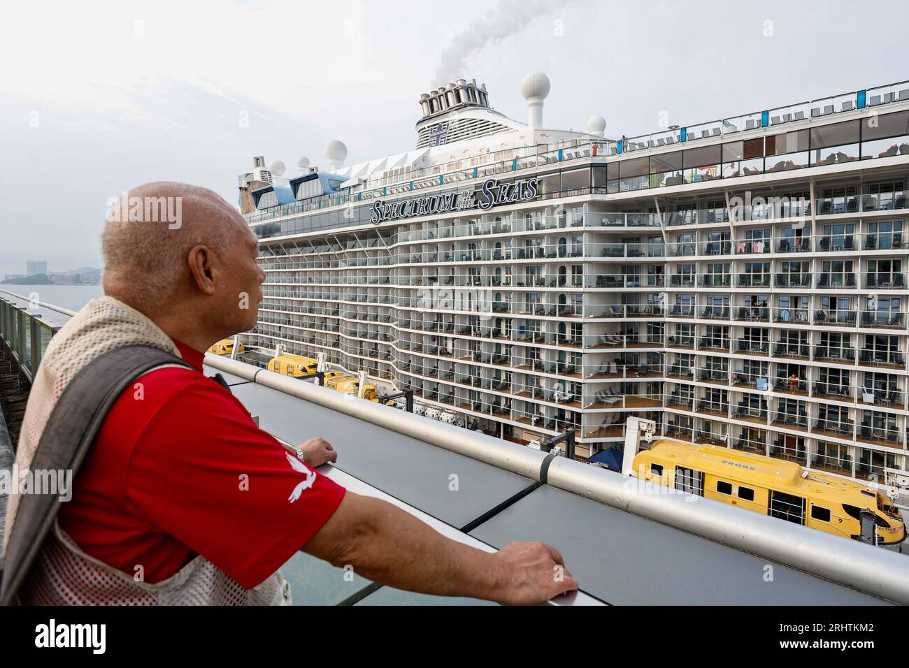 August 19, 2023, Hong Kong, Hong Kong, Hong Kong: An elderly man looking at cruise ship SPECTRUM OF THE SEAS after it berthed at Kai Tak cruise terminal with nearly 4,000 tourists and Hong Kong locals on board from Kagoshima. The Hong Kong government has been working on luring international travelers to the Asia's World City to boost the economy, including attracting tourists from mainland China and Southeast Asian countries by giving free cash vouchers for shopping and food. Credit: ZUMA Press, Inc./Alamy Live News Stock Photo