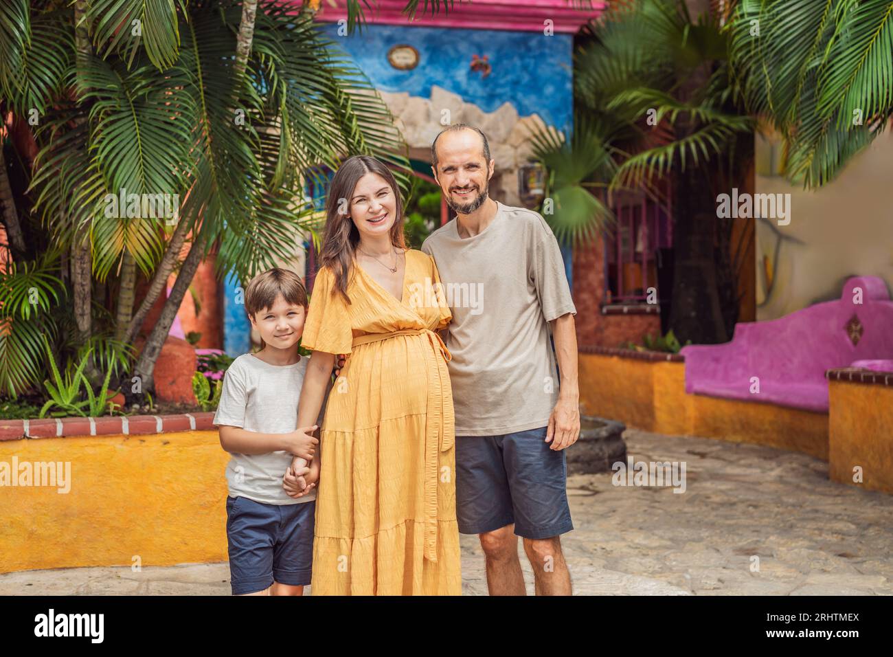A loving couple in their 40s and their teenage son cherishing the miracle of childbirth in Mexico, embracing the journey of parenthood with joy and Stock Photo