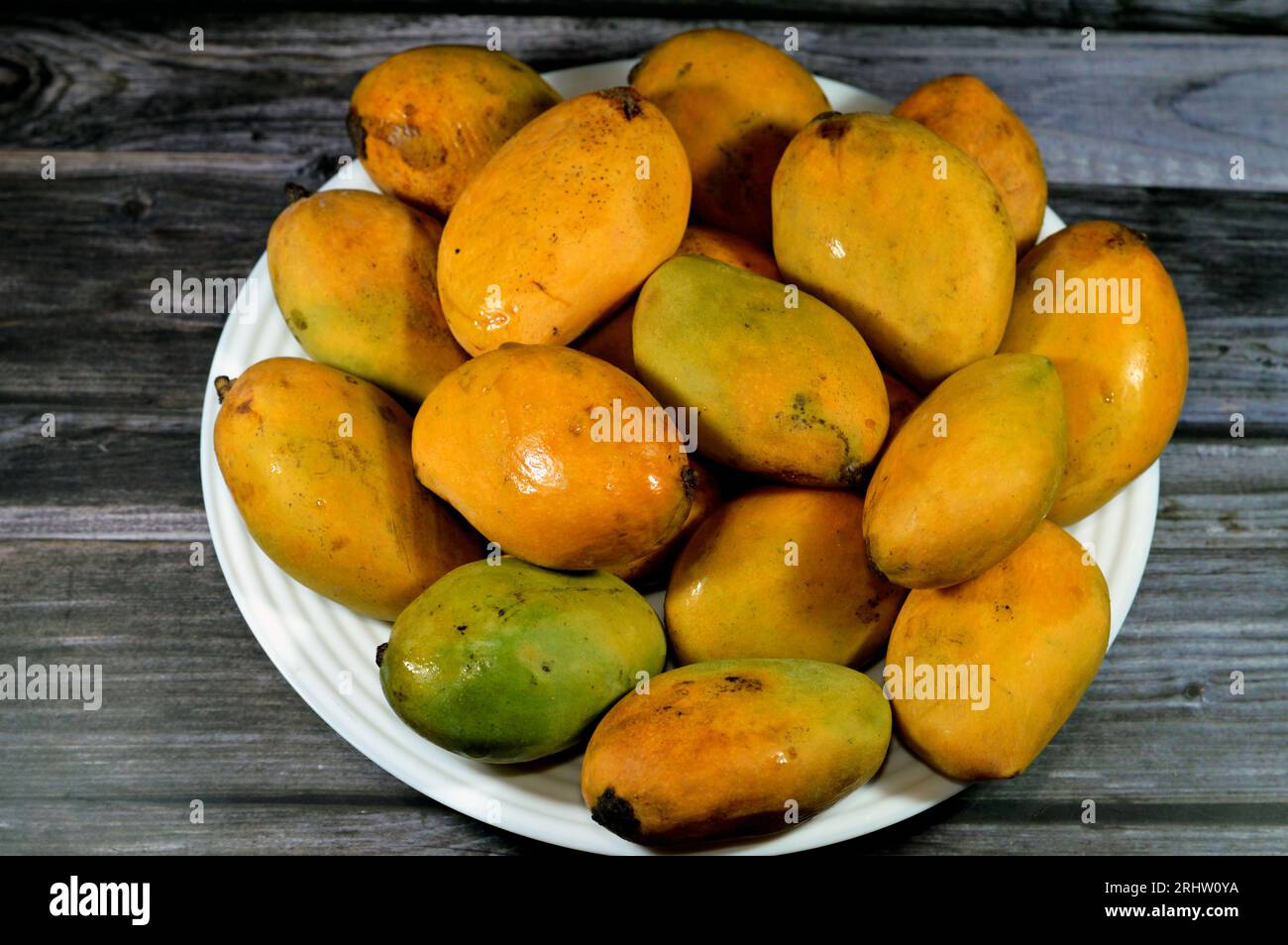 Plate of Egyptian fresh mango fruit with tropical delicacy, mangoes are