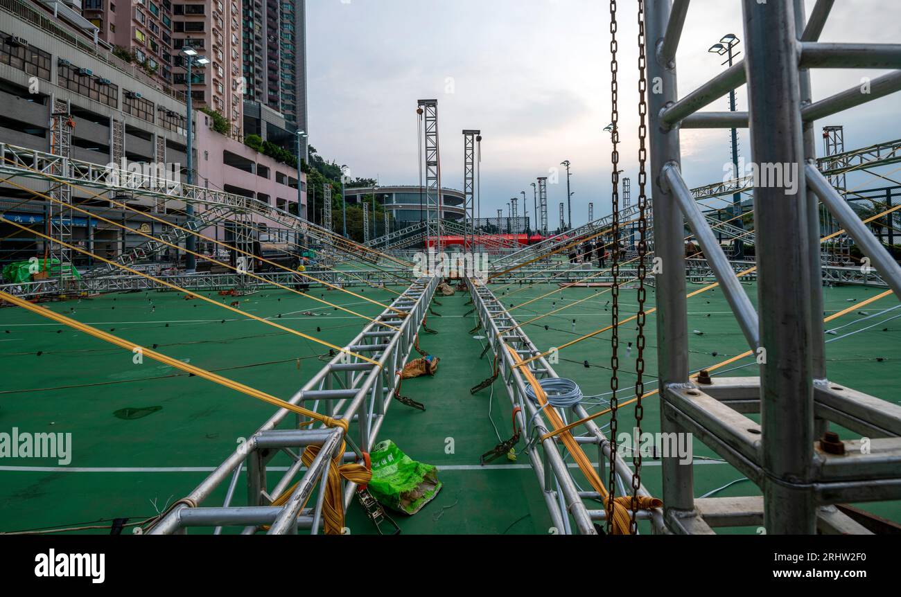 Construction workers using steel scaffolding instead of the common and traditional bamboo scaffolding, Hong Kong, China. Stock Photo