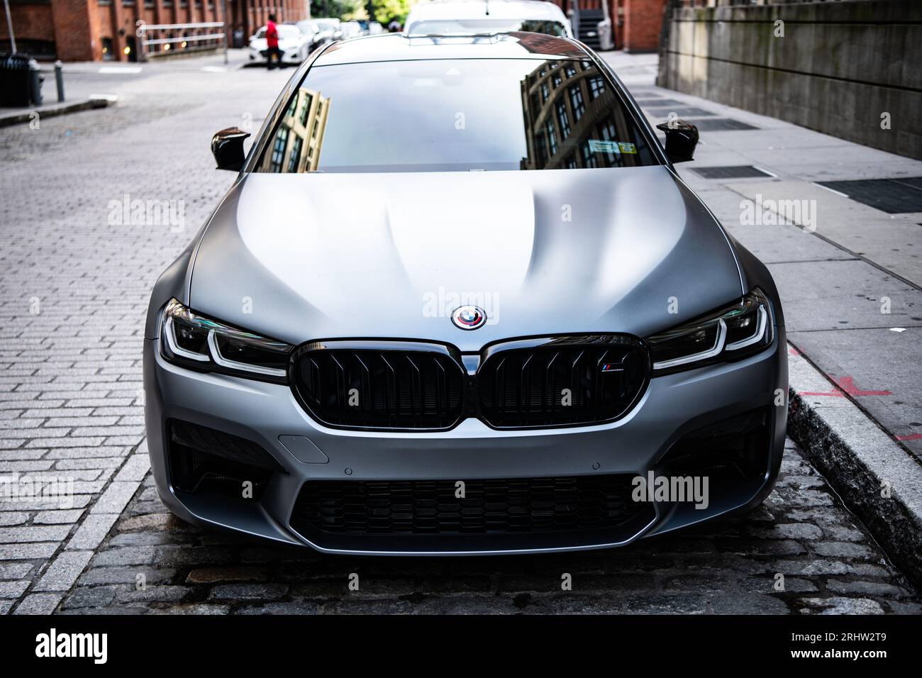New York City, USA - July 15, 2023: BMW F90 M5 grey color car parked, front view. Stock Photo