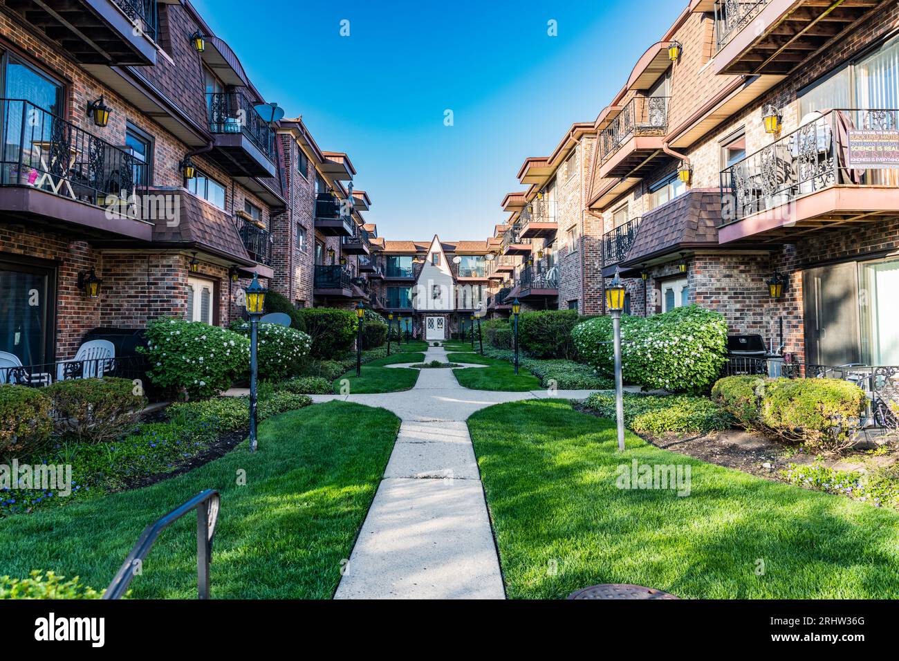 property in neighborhood. view of luxury upscale residential neighborhood community street. property insurance and real estate. suburban neighborhood. Stock Photo