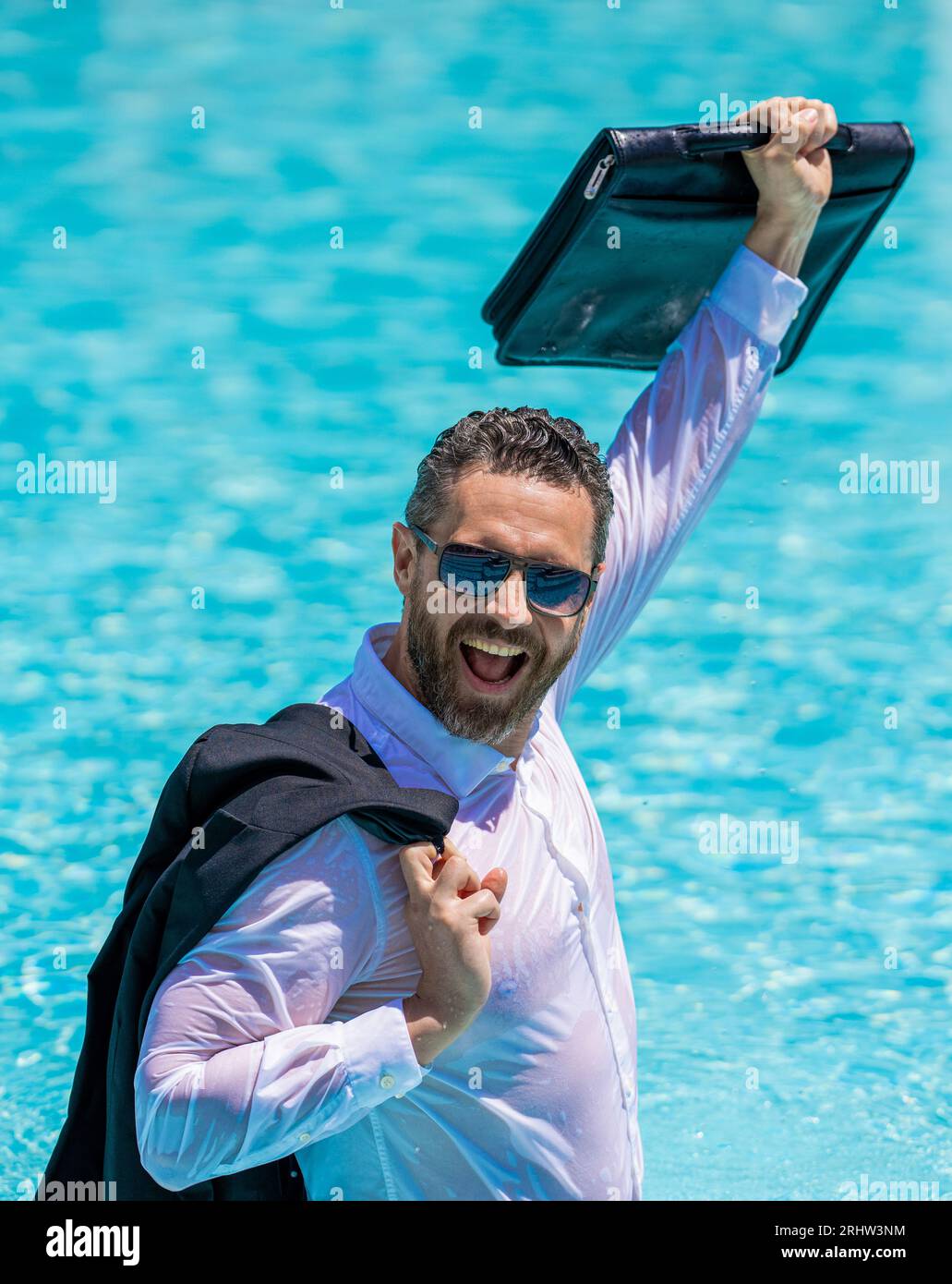 Business success man outdoor. Businessman in suit with briefcase in pool. Businessman successful deal. Successful project. Businessman in swimming poo Stock Photo