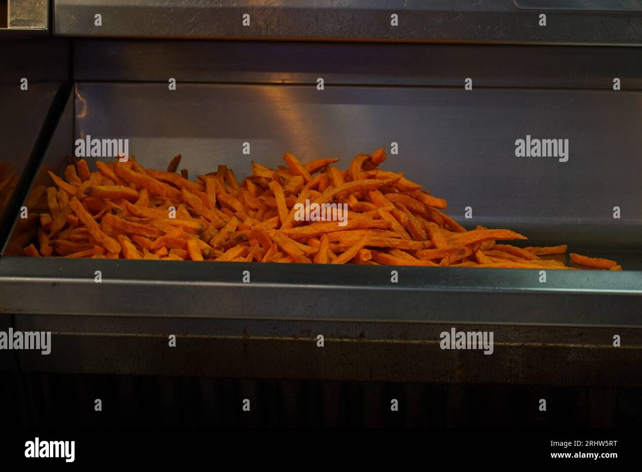 French fries in deep fryer at restaurant kitchen Stock Photo Alamy