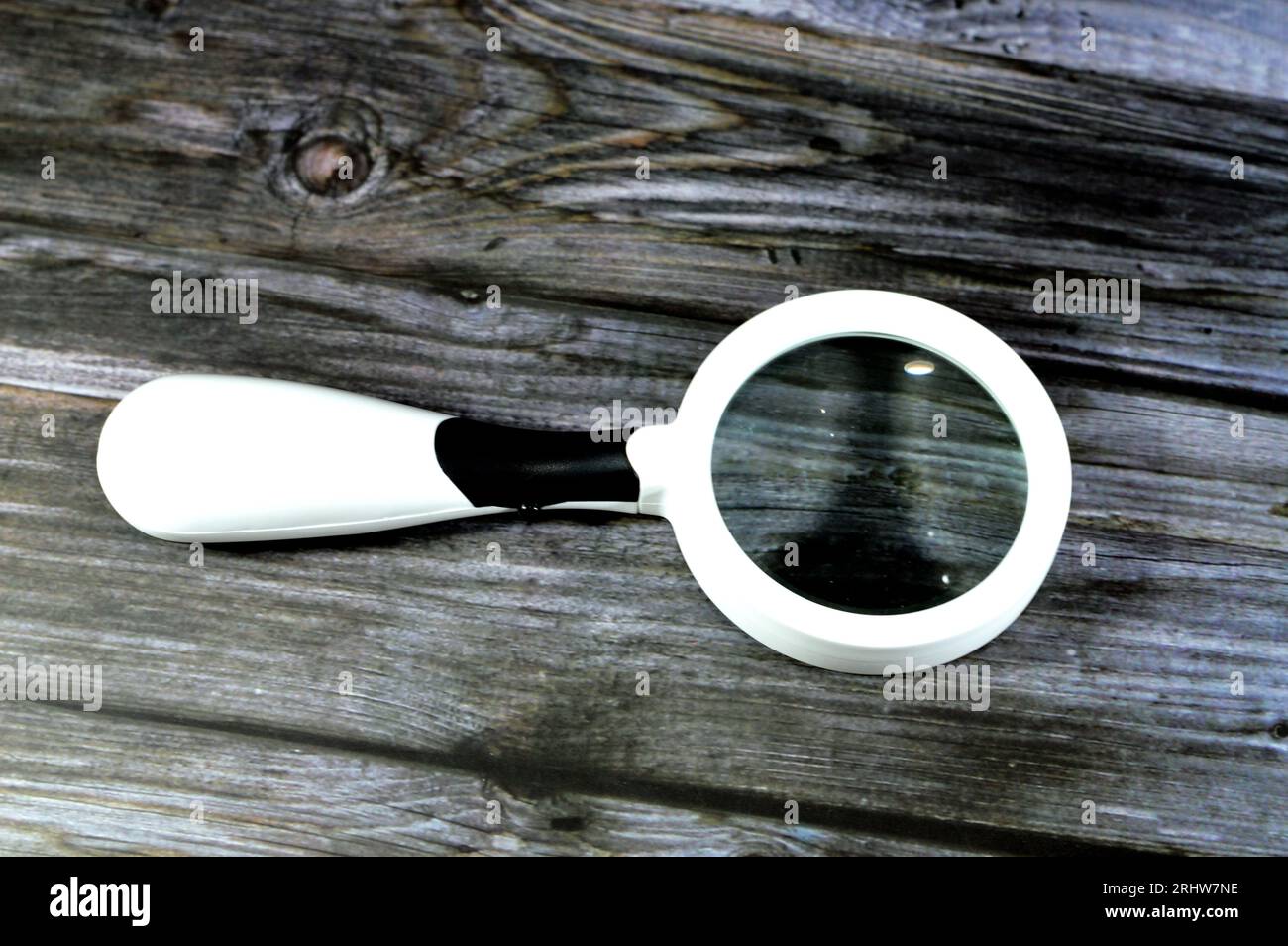A magnifying glass, a convex lens that is used to produce a magnified