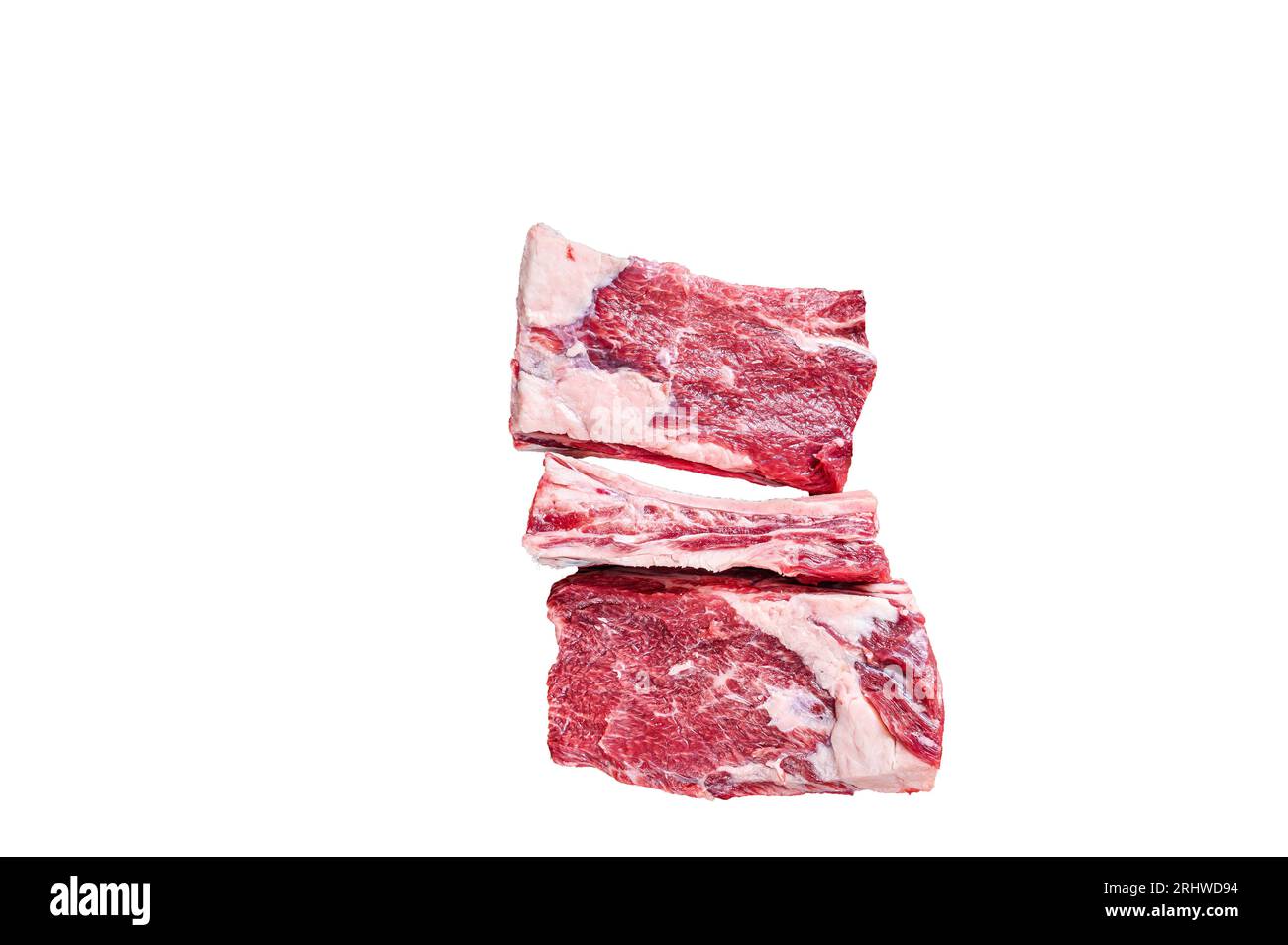 Raw beef calf short ribs meat on a butcher cutting board with cleaver ...