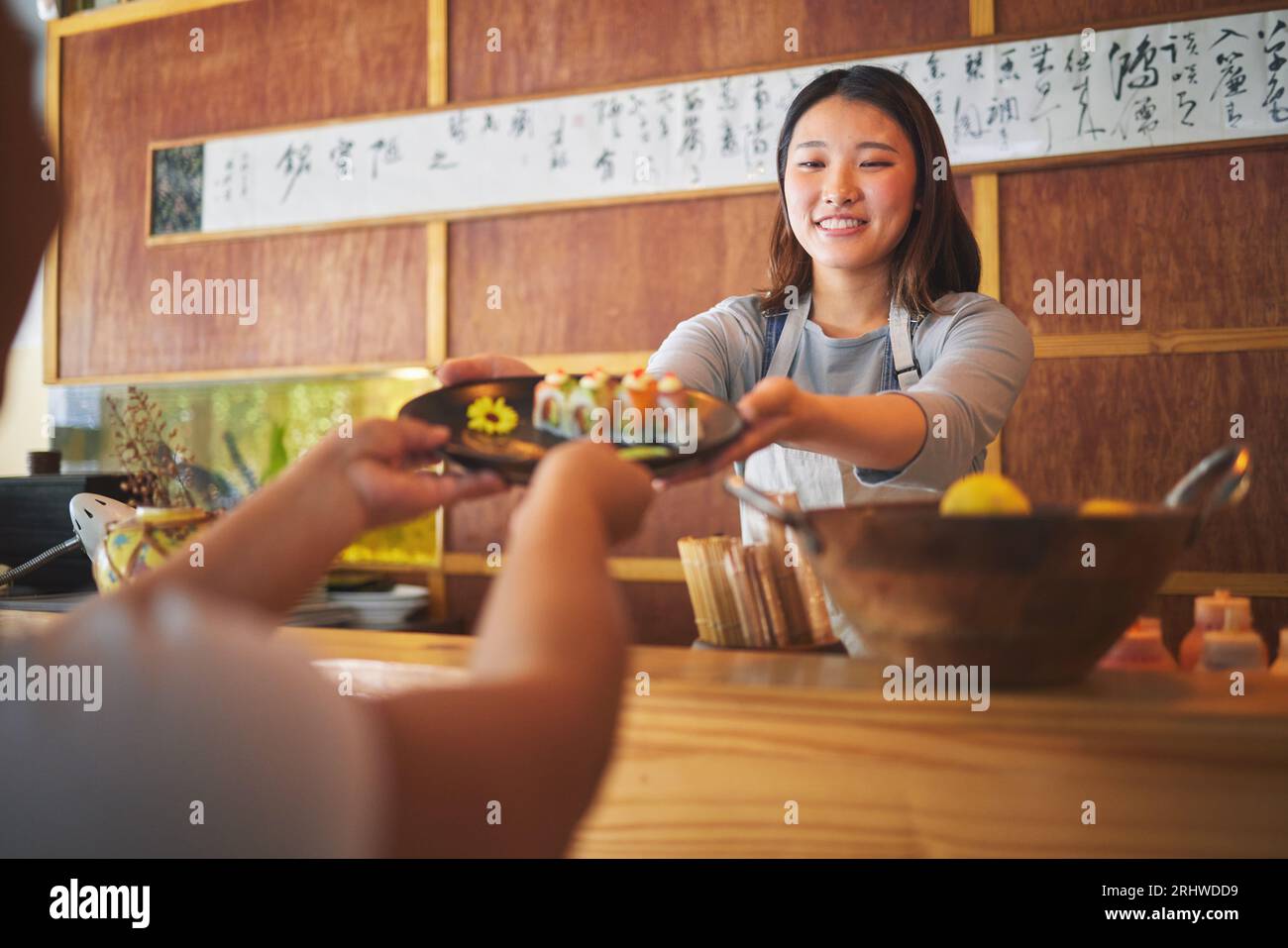 https://c8.alamy.com/comp/2RHWDD9/waiter-giving-sushi-plate-and-restaurant-with-hands-helping-and-catering-job-with-customer-seafood-chef-fast-food-server-and-cooking-in-cafe-2RHWDD9.jpg